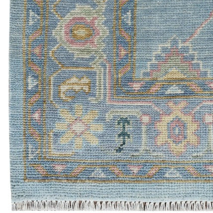 Close-up of a blue patterned rug with intricate designs
