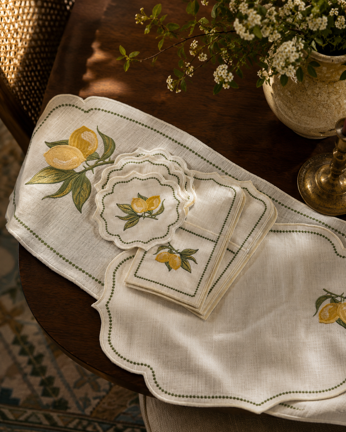 Yellow lemon embroidery on an ivory scalloped placemat