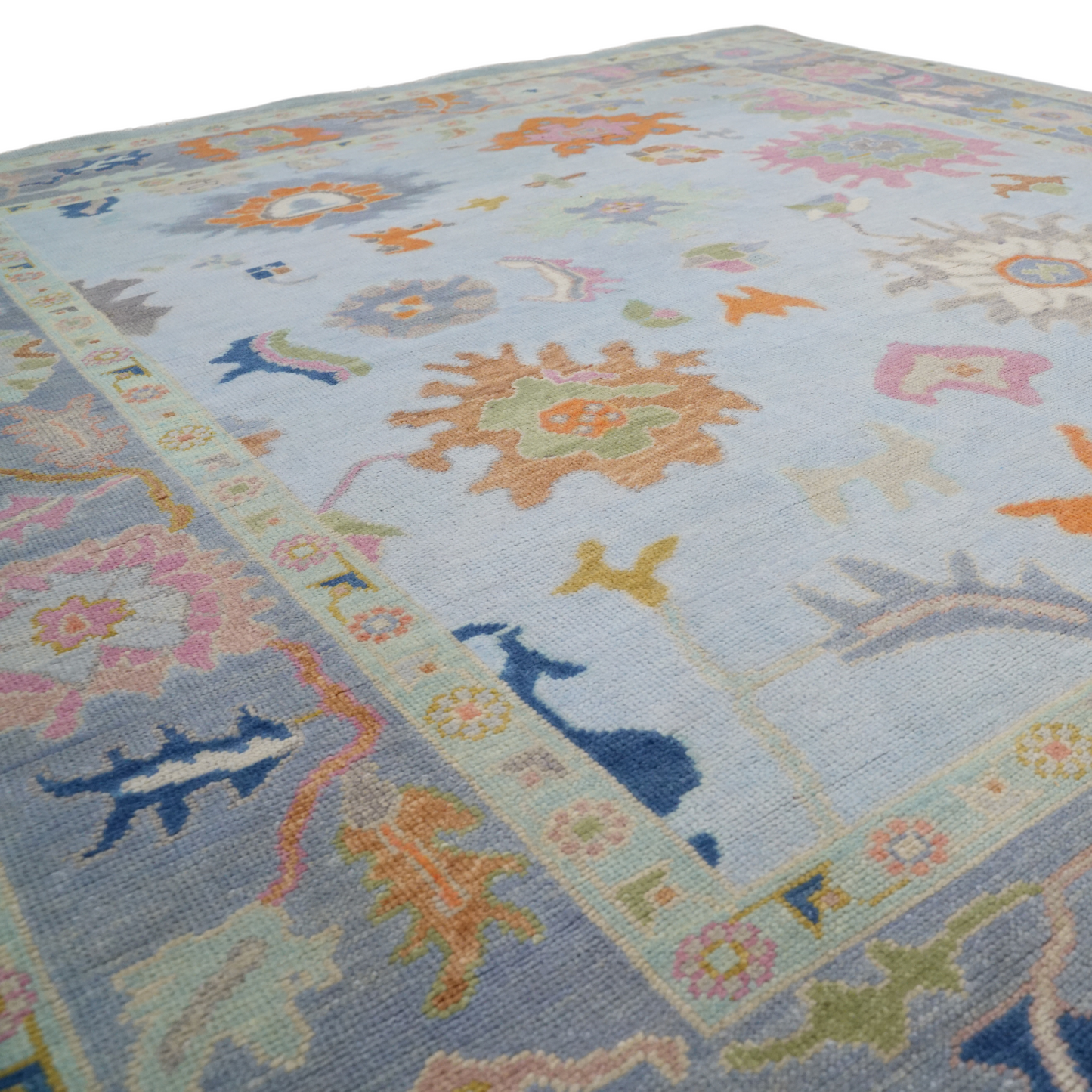 Colorful floral-patterned rug on a plain background