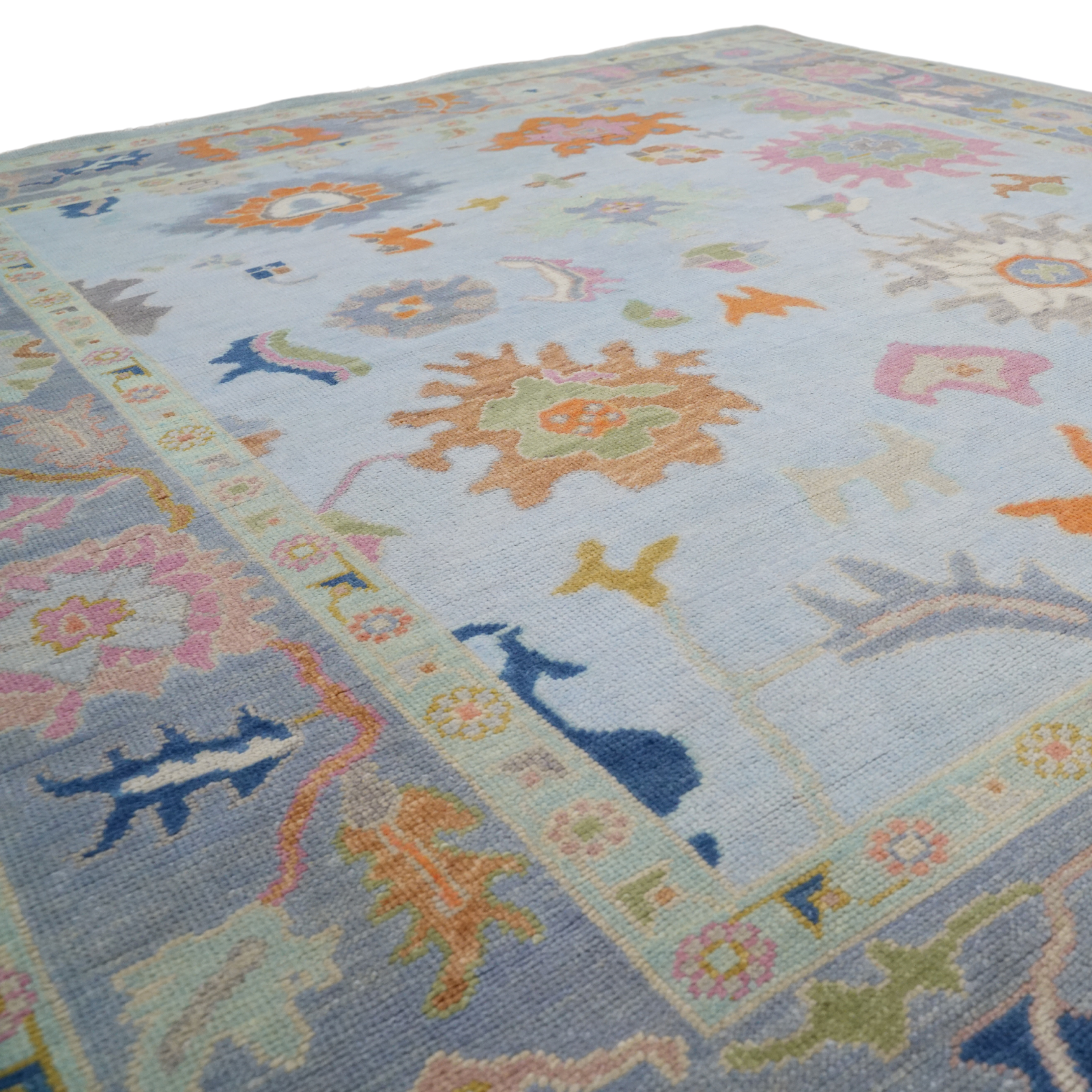 Colorful floral-patterned rug on a plain background