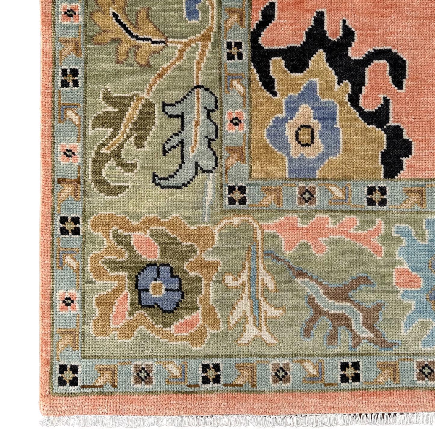 Decorative rug with intricate patterns and colors on a white background