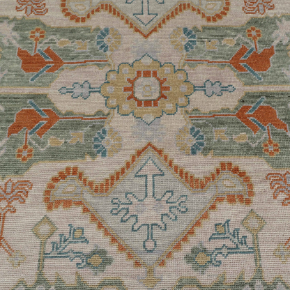 Close-up of a patterned rug with geometric and floral designs.