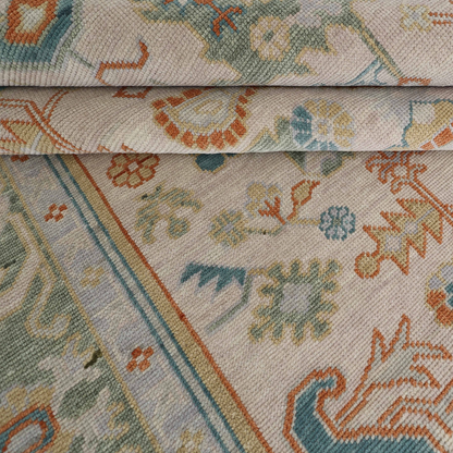 Close-up of a patterned fabric with intricate designs in various colors.