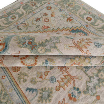 Close-up of a patterned fabric with intricate designs on a plain background