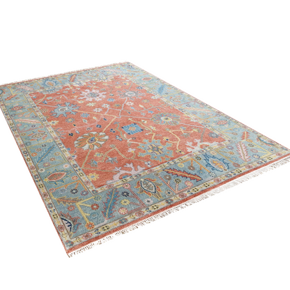 Georgia handmade Oushak rug with blue botanical border