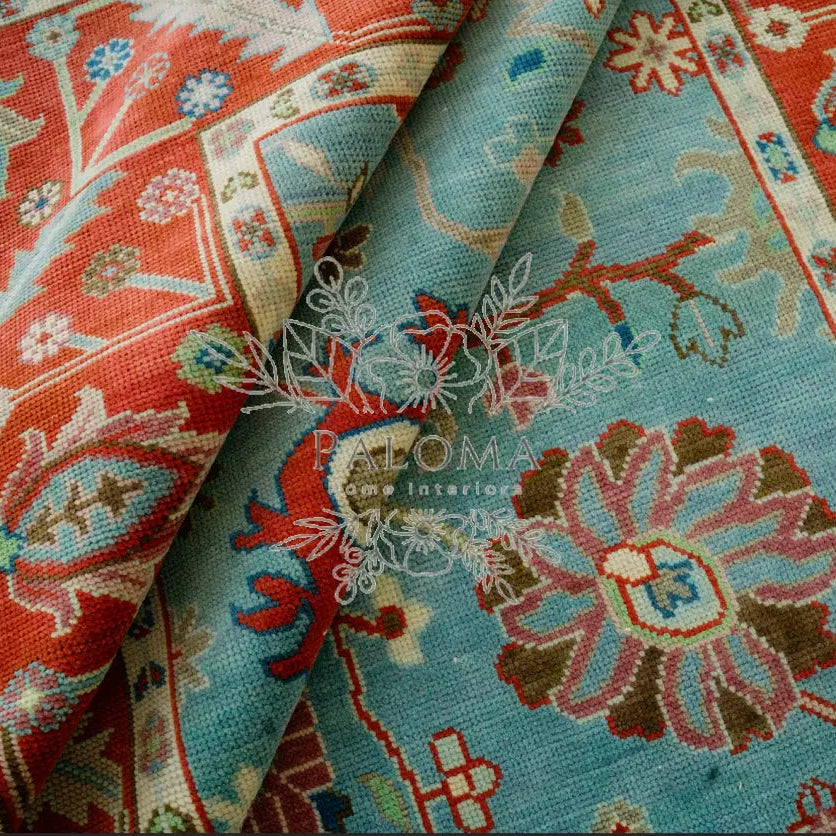 Heidi luxury handmade wool rug with rust and turquoise hues and Oushak inspired motif artisan-crafted rug for refined interiors