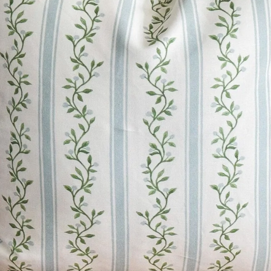 green leaf pattern and blue stripes on a white background