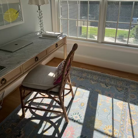 Mary handmade wool rug styled in a calm and elegant desk room