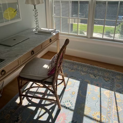 Mary handmade wool rug styled in a calm and elegant desk room