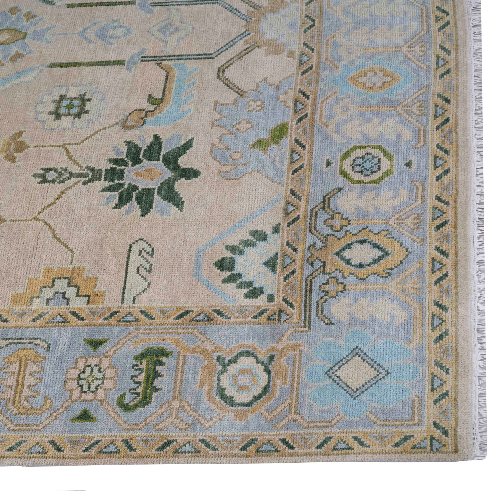 Close-up of a patterned rug with floral and geometric designs.