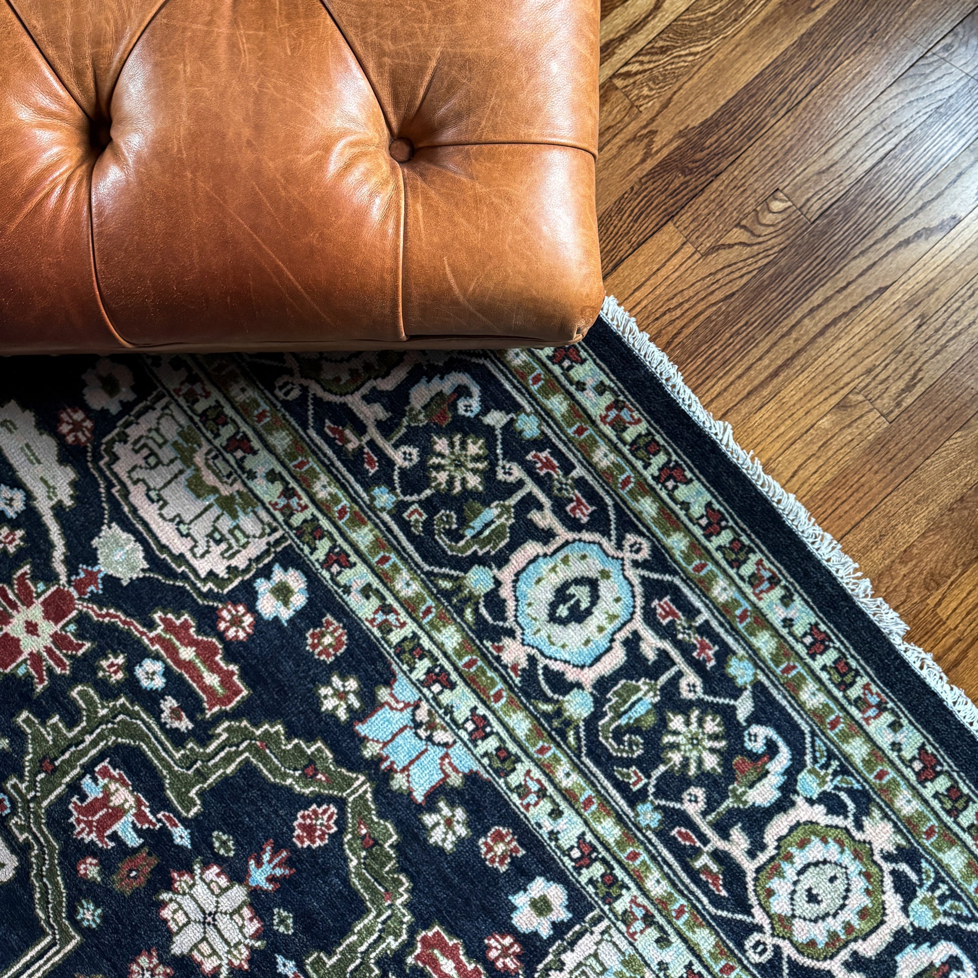Detailed floral border on the Eleanor Oushak area rug