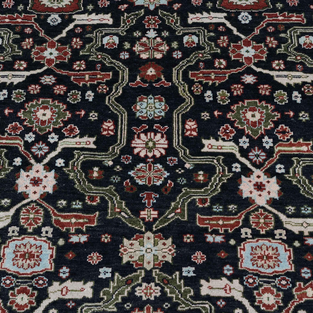 Close-up of the Eleanor rug’s navy, red and pale blue pattern