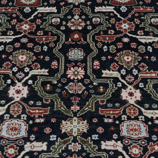 Close-up of the Eleanor rug’s navy, red and pale blue pattern