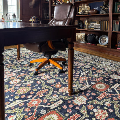 Eleanor traditional area rug styled in a dark wood home office